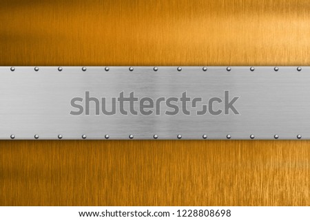 Brushed metal plate with rivets
