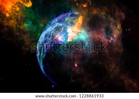 Landscape background of fantasy alien galaxy nebula with colorful glowing spherical clouds and stars. The elements of this image furnished by NASA.