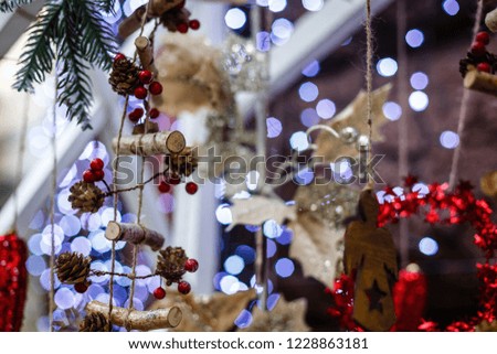 Christmas decor close-up, mistletoe berries, cones, and lights