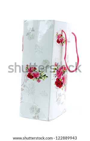a floral glossy paper bag isolated on white background