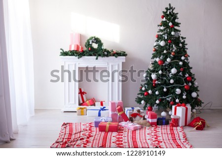 Christmas tree with Garland decoration and gifts for the new year