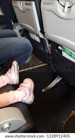 Flying with kids. Having fun while travelling with children. This is a perfect age to collect new experiences together. Royalty-Free Stock Photo #1228912405