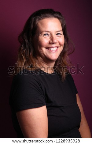 Woman in front of a colored background