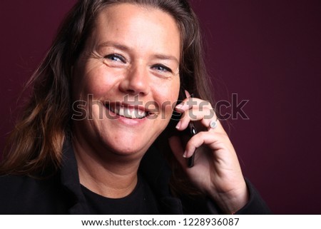 Woman in front of a colored background