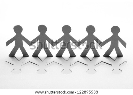 Paper people in teamwork concept