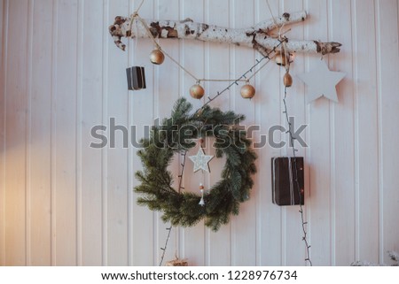 christmas decorative gifts rustic toys stars garland and fire in background bokeh lights holiday concept