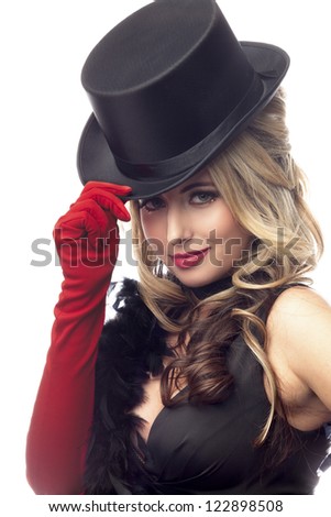 Portrait of a attractive female fashion model posing with a hat over white background