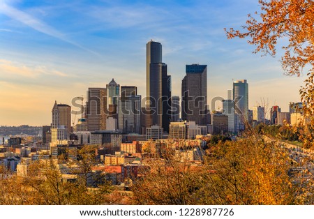 Seattle downtown skyline  at sunset in the fall with yellow foliage in the foreground view from Dr. Jose Rizal Park