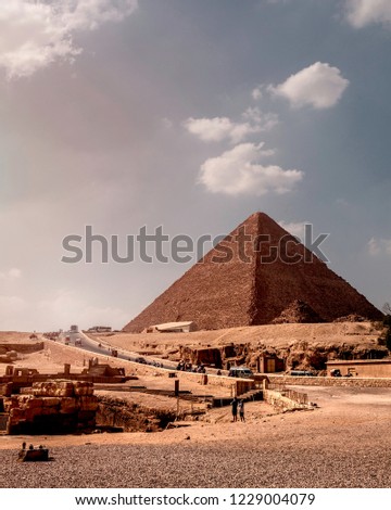 A vertical colour image of Great Pyramid of Giza (Khufu) captured in the summer in July 2018 in Giza Pyramids district in Egypt.