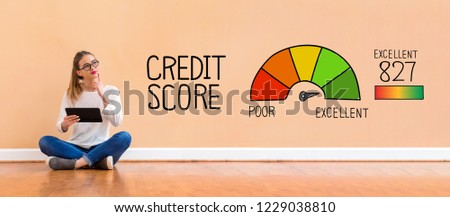 Excellent credit score with young woman holding a tablet computer