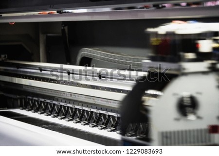 Large printer format inkjet working.
