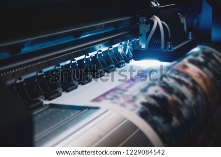 Close-up of inkjet printers in large machines. Royalty-Free Stock Photo #1229084542