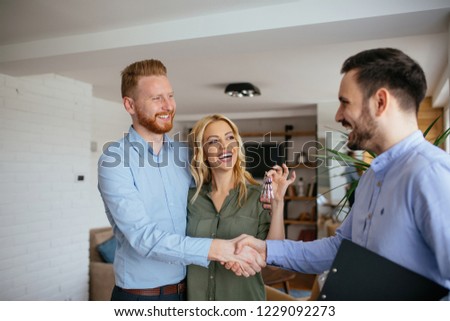 Couple makes deal with real estate agent about new apartment Royalty-Free Stock Photo #1229092273