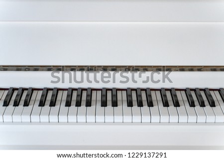 White grand piano with black and white keys, classic modern music room. Royal instrument. Clean background, texture, abstraction, music, classical music, synthesizer, royal, musical instrument