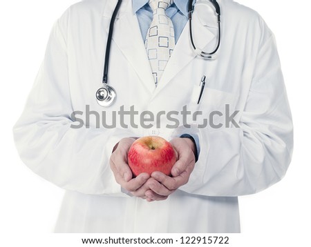 Cropped image of a doctor holding an apple over white background