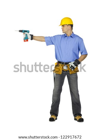 Image of a manual construction worker wearing tool belt, hard hat and holding drill machine.