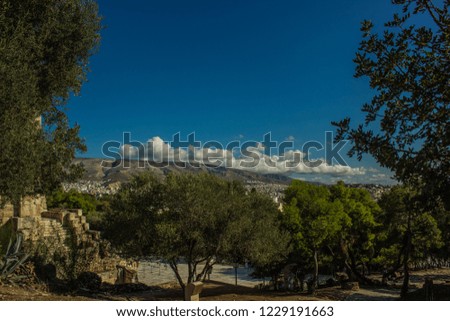 tree frame and mountain scenic landscape background, ancient stone ruins in this district 