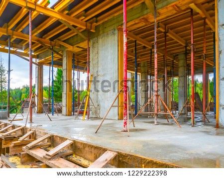 Construction of the building. Pouring concrete. Formwork for pouring concrete. Construction site. Royalty-Free Stock Photo #1229222398