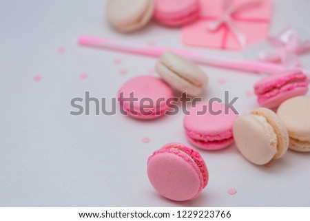 A wonderful gift for Christmas. Beautiful variety of macaroons on white canvas background.