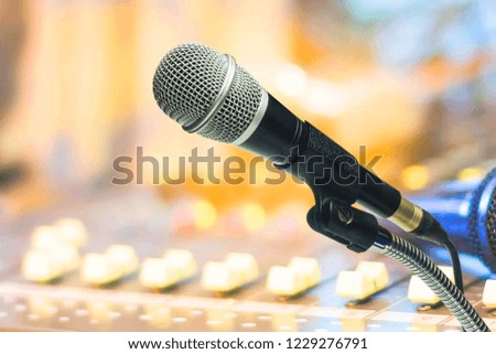 The microphone with recording equipment.