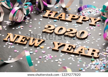 Happy year 2020 - Letters in wood. Black background