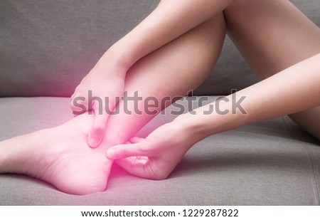 Achilles Tendinitis with red spot, Injury after exercising and running. Need to see doctor for treatment Royalty-Free Stock Photo #1229287822