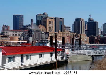   A picture of waterboat and  St. Paul skyline from  harriet Island