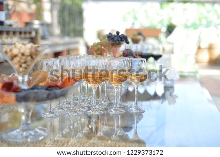 different types of wine in bottles and cups