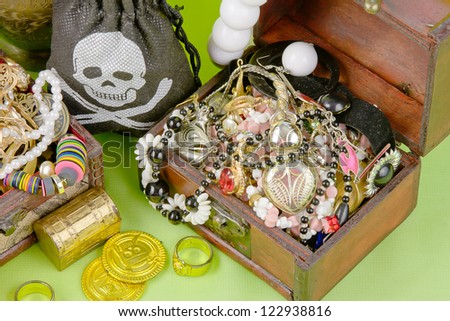two small boxes with treasures on a light green background