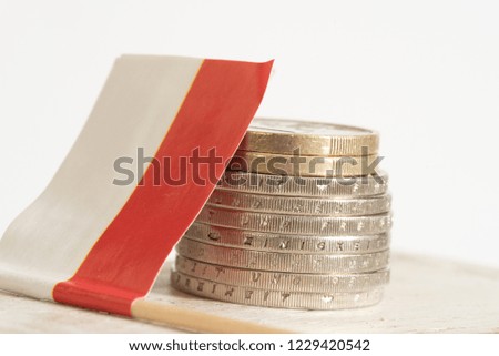 Flag of Poland and Euro coins
