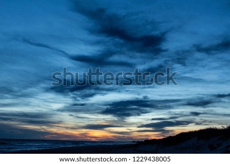 Nantucket ocean waves during sunset.