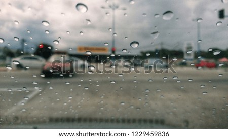 Rain drops on the car window. Blurred, Grain image. Selective focus. .