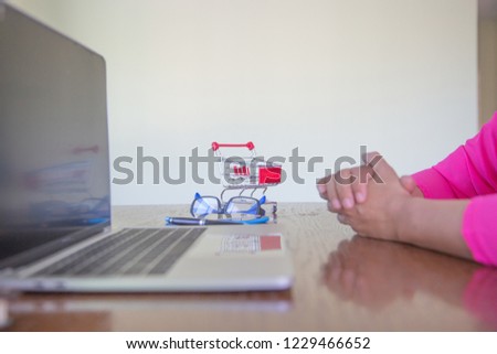 women shoping online by notebook on desk about at coffee shop. shoping online concept