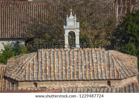 The roof of the old house and the church