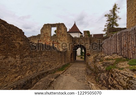 Narrow way to the main courtyard of Landstejn Castle. It is the oldest and best preserved Romanesque castle in Europe. Travel and tourism concept. Summer cloudy day. South Bohemian, Czech Republic.