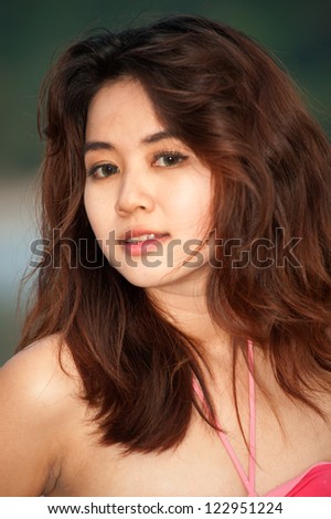 Portrait of pretty Asian woman .