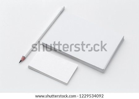 White blank business card. Office table desk with pencil. Top view and copy space for ad text