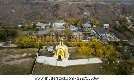 Aerial drone shot a small yellow church