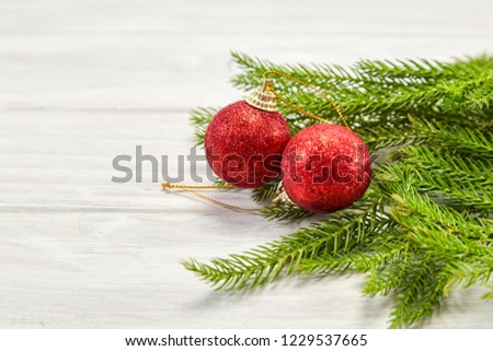 Red xmas ornaments on white wooden table background. Merry christmas card. Winter holiday theme. Happy New Year 2019. Space for text.