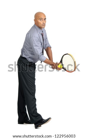 Businessman playing tennis isolated in white