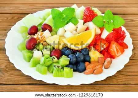 Fruits Salad against wooden background