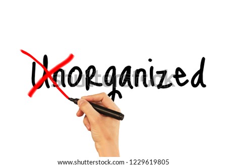 Unorganized - male hand writing text on white background.