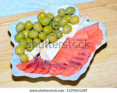 slices of salted salmon, fresh olives and butter for dinner