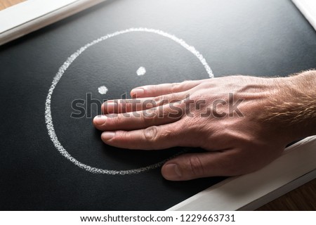 Censorship, freedom of speech or conspiracy theory concept. Secret, taboo topic or gossip.  No talking, silence or forbidden bad curse words. Hand covering mouth drawn on chalkboard, blackboard. Royalty-Free Stock Photo #1229663731