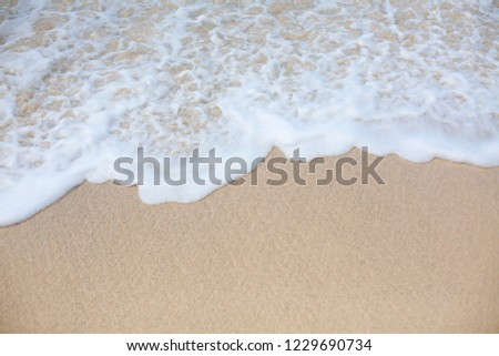 Wave on the white sand