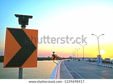 scenery traffic warning sign with led light power by small solar panel install on top before sunset in close up style so beautiful outdoor pattern for signage background