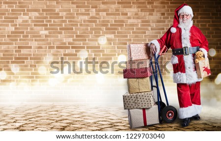 Santa Claus with presents on a delivery trolley in a postal theme with festive lighting and an industrial background.