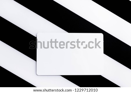 Topview of White credit card or blank business card on black and white background.