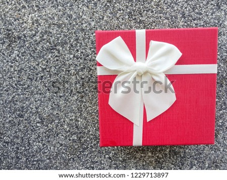 Gift box on the stone wall