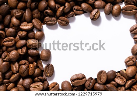 White credit card or blank business card on black on coffee background.